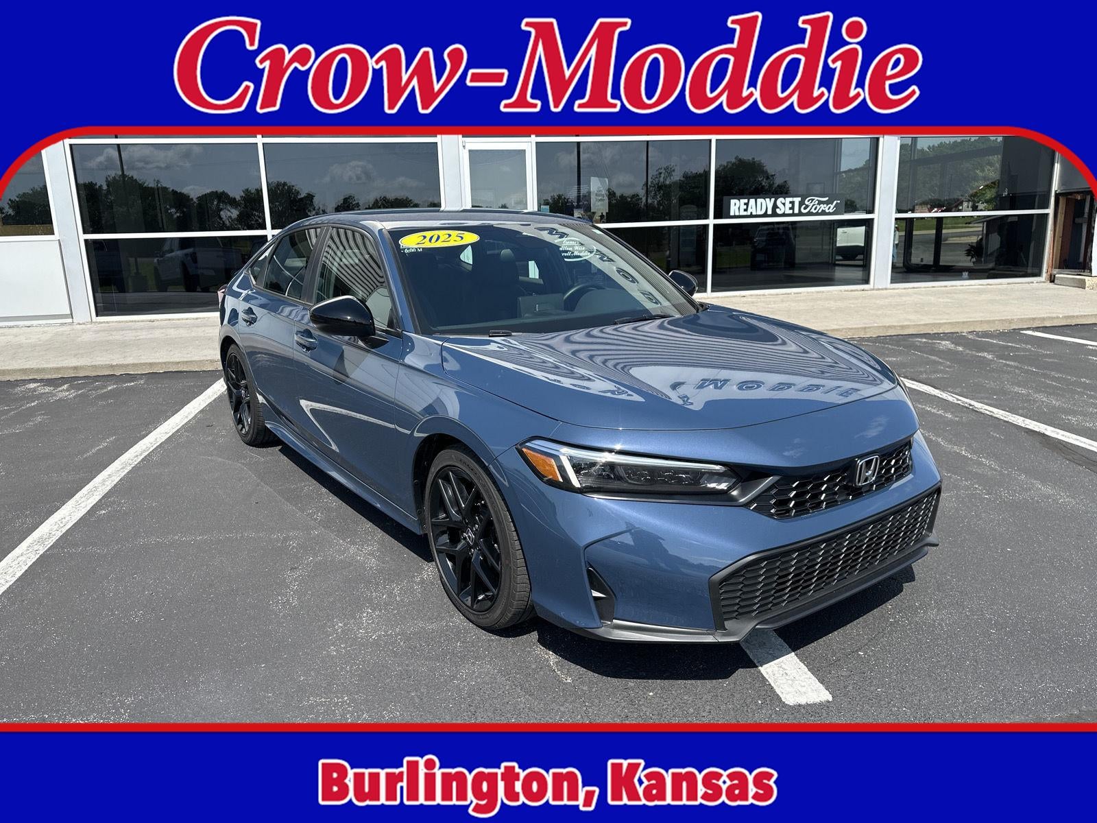 2025 Honda Civic Sedan Sport in Blue — front three-quarter view